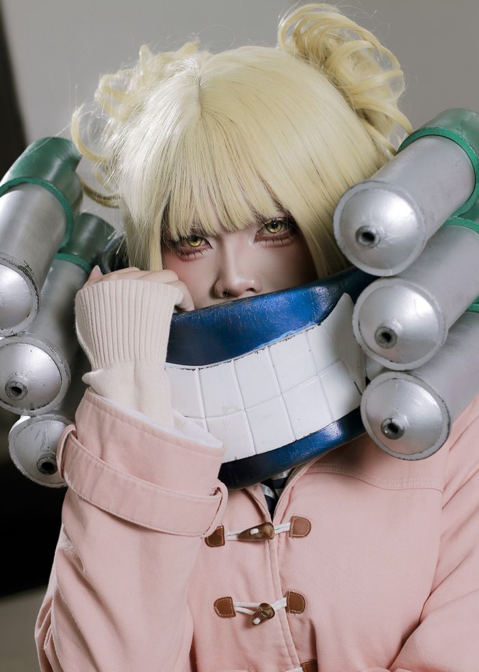 Colorful anime cosplay portrait featuring detailed costume and prop accessories.
