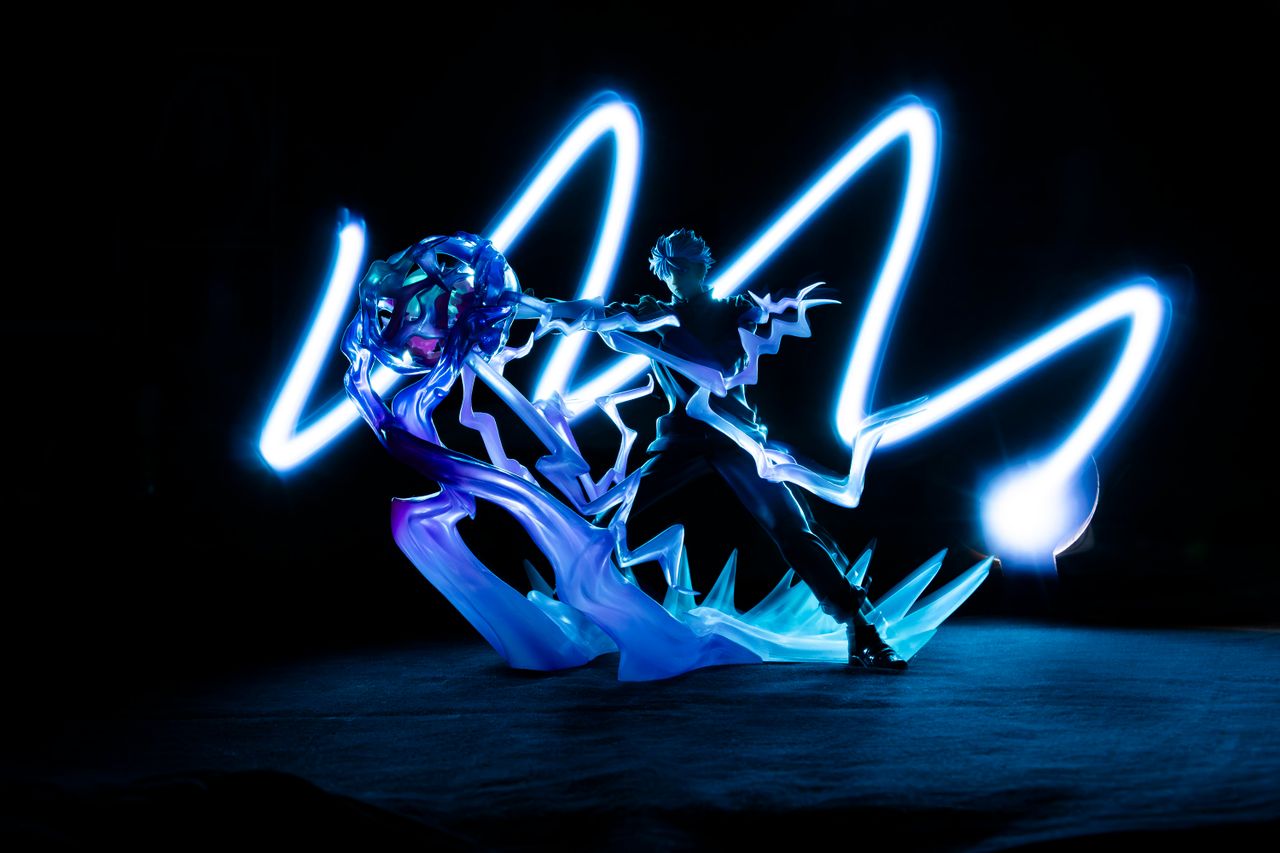 A captivating long exposure shot showcasing dynamic light painting with vivid blue streaks.